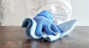 wiping down surface with microfiber cloth